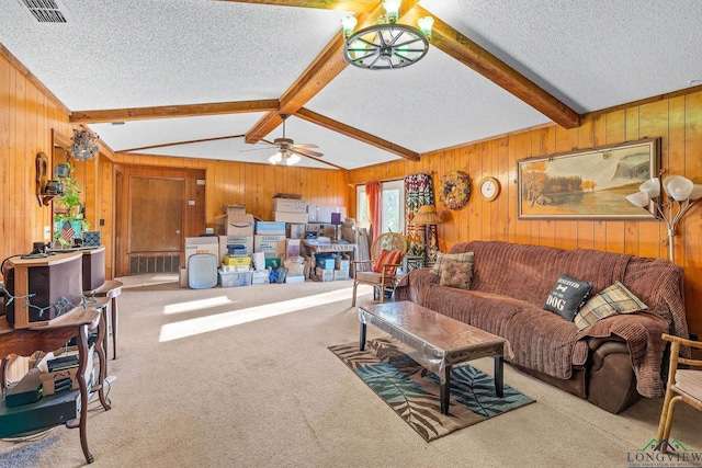 living room with lofted ceiling with beams, a textured ceiling, light colored carpet, and ceiling fan