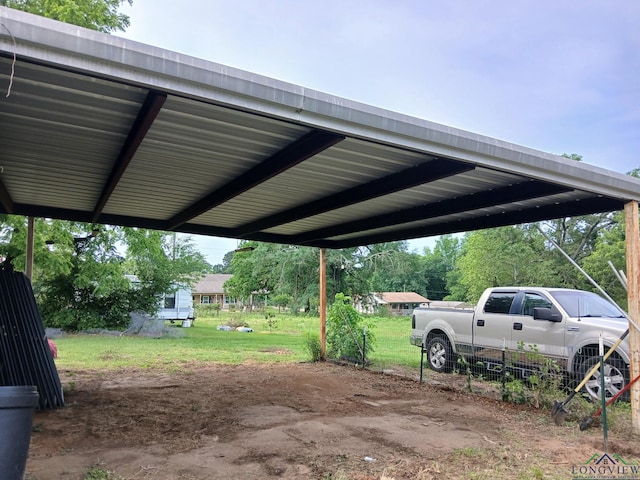 1103 Long St, Gladewater, TX 75647 - view of vehicle parking with a detached carport