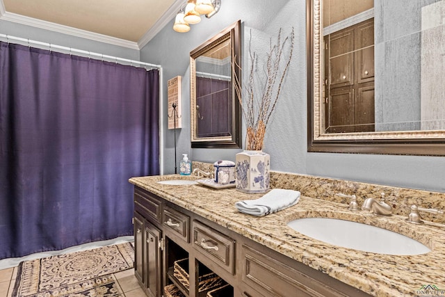 full bathroom featuring tile patterned flooring, crown molding, a sink, and double vanity