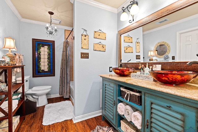 bathroom featuring toilet, a notable chandelier, visible vents, and wood finished floors