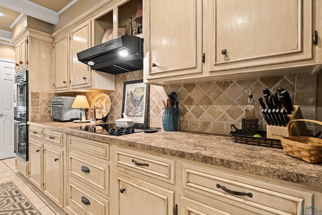kitchen featuring ornamental molding, light countertops, light tile patterned flooring, and black appliances
