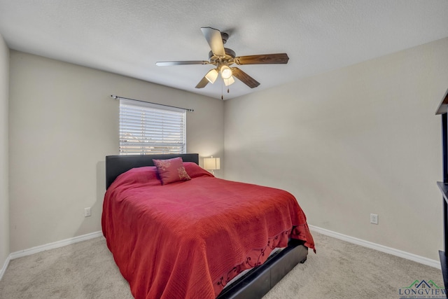 bedroom featuring carpet flooring, a ceiling fan, and baseboards