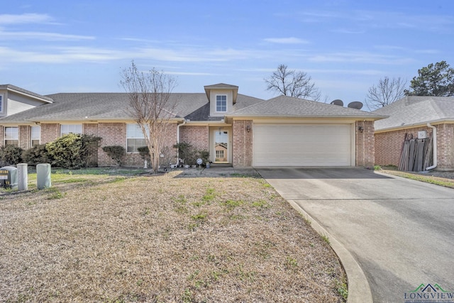 view of front of house with a garage, brick siding, driveway, and roof with shingles