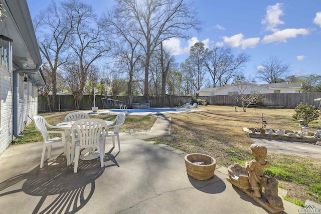 view of patio with a fenced in pool and a fenced backyard