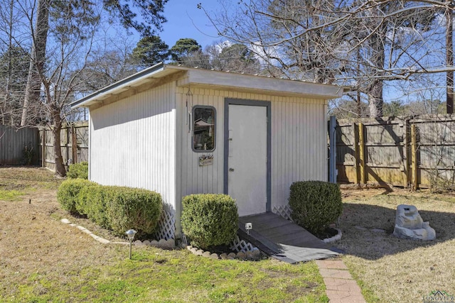 view of shed featuring fence