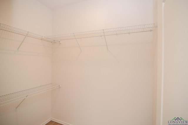 1146 Mission Creek Dr, Longview, TX 75601 - walk in closet with wood finished floors