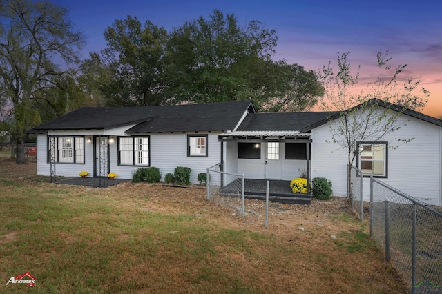 view of front of home with a yard