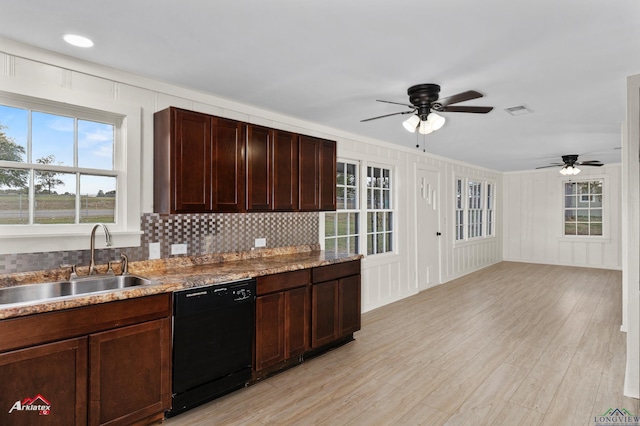 kitchen featuring dark brown cabinetry, ceiling fan, sink, black dishwasher, and decorative backsplash