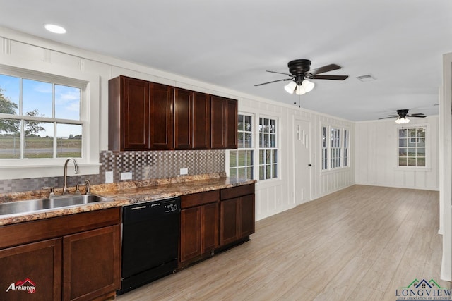 kitchen featuring ceiling fan, sink, decorative backsplash, and black dishwasher