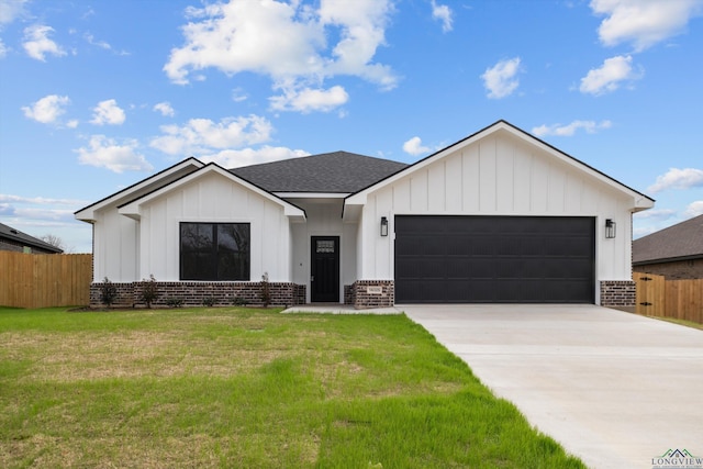 view of front facade featuring a garage, brick siding, board and batten siding, and fence