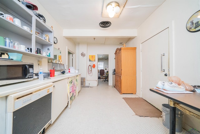 911 S Helen St, Overton, TX 75684 - kitchen featuring stainless steel microwave, dishwasher, light countertops, and open shelves
