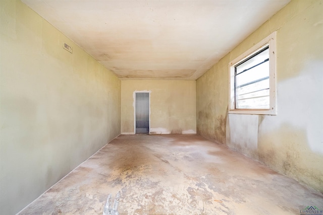911 S Helen St, Overton, TX 75684 - empty room with unfinished concrete flooring
