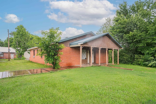 911 S Helen St, Overton, TX 75684 - view of front of property with a front lawn and brick siding