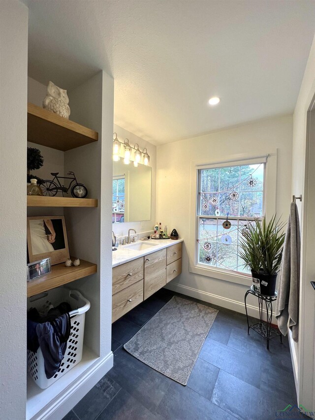 7 Rockwall Dr, Longview, TX 75604 - bathroom with vanity, baseboards, and recessed lighting
