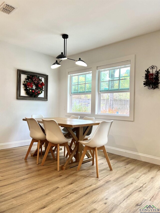 7 Rockwall Dr, Longview, TX 75604 - dining area featuring light wood-style flooring, baseboards, and healthy amount of natural light