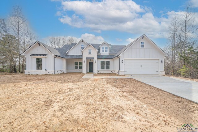 modern farmhouse style home featuring a garage