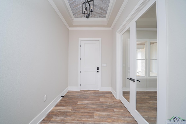 entrance foyer with wood-type flooring and ornamental molding