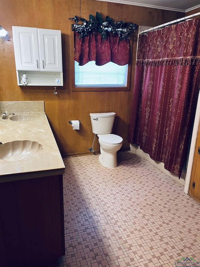 bathroom featuring a shower with curtain, vanity, toilet, and wood walls