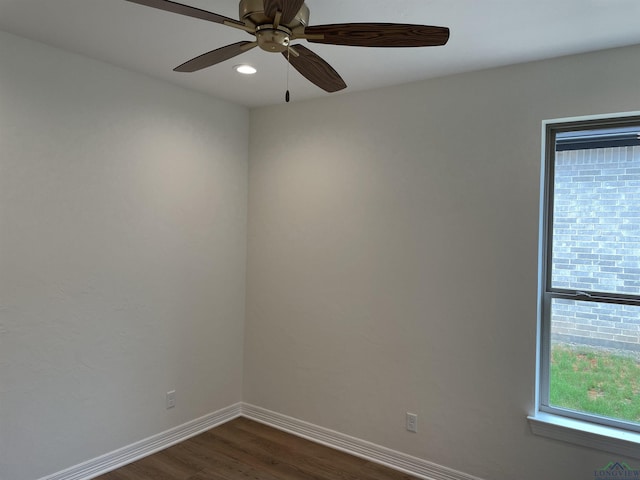 unfurnished room featuring dark hardwood / wood-style floors and ceiling fan