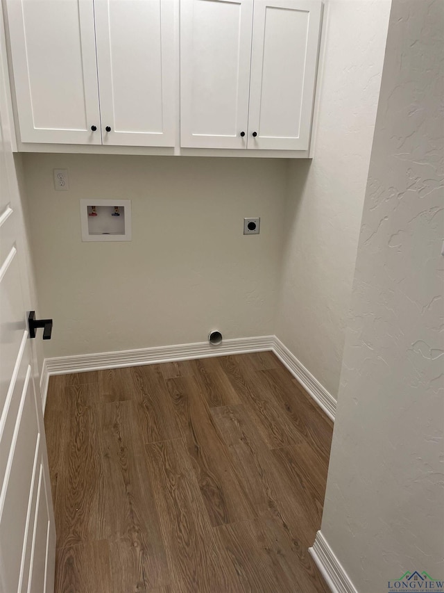 washroom featuring cabinets, hookup for a washing machine, electric dryer hookup, and wood-type flooring