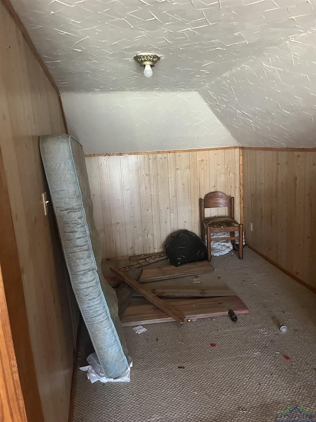 1401 Gay St, Longview, TX 75602 - bonus room with wood walls, carpet, and lofted ceiling
