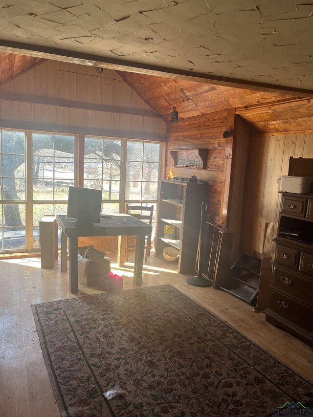 1401 Gay St, Longview, TX 75602 - dining room with hardwood / wood-style floors, wood walls, and vaulted ceiling
