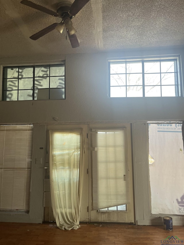 1401 Gay St, Longview, TX 75602 - entrance foyer featuring ceiling fan, wood finished floors, and a textured ceiling