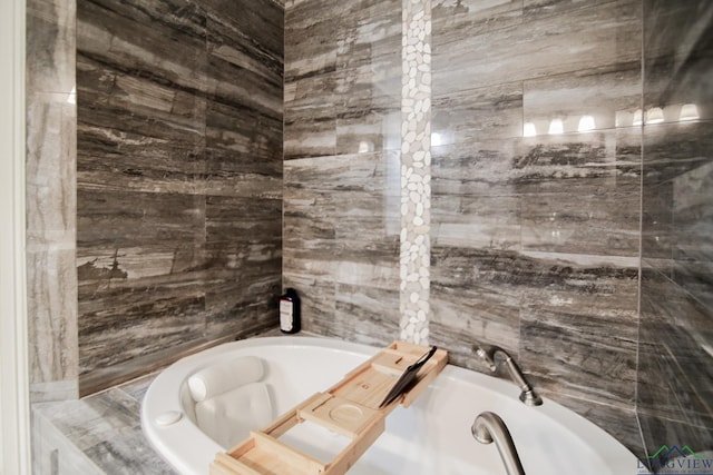 full bath with a garden tub