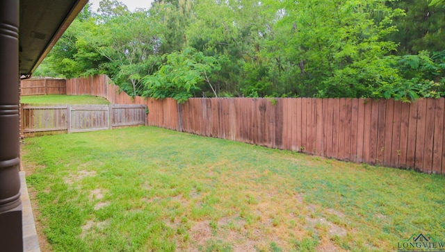 view of yard with a fenced backyard