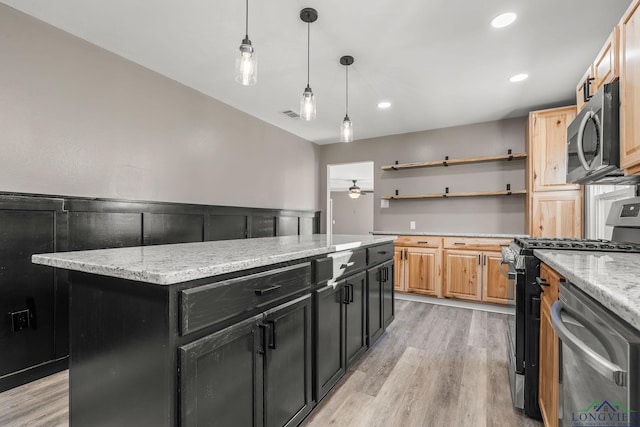 2210 E Harold St, Gladewater, TX 75647 - kitchen with stainless steel appliances, a center island, dark cabinetry, and open shelves