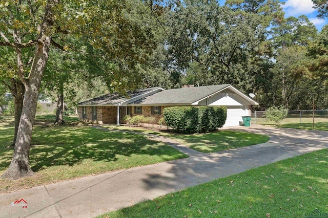 single story home featuring a front lawn and a garage