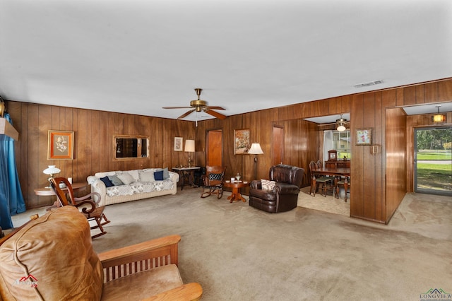 living room featuring ceiling fan and light colored carpet