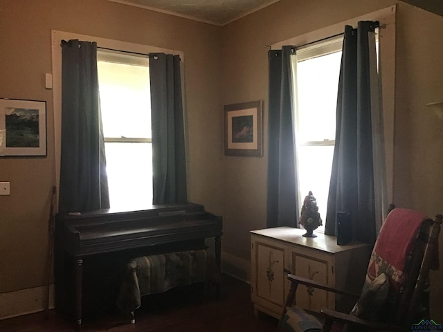 436 S Main St, Longview, TX 75601 - sitting room with plenty of natural light, ornamental molding, and dark wood-style flooring