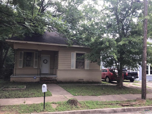436 S Main St, Longview, TX 75601 - bungalow-style house featuring brick siding and covered porch