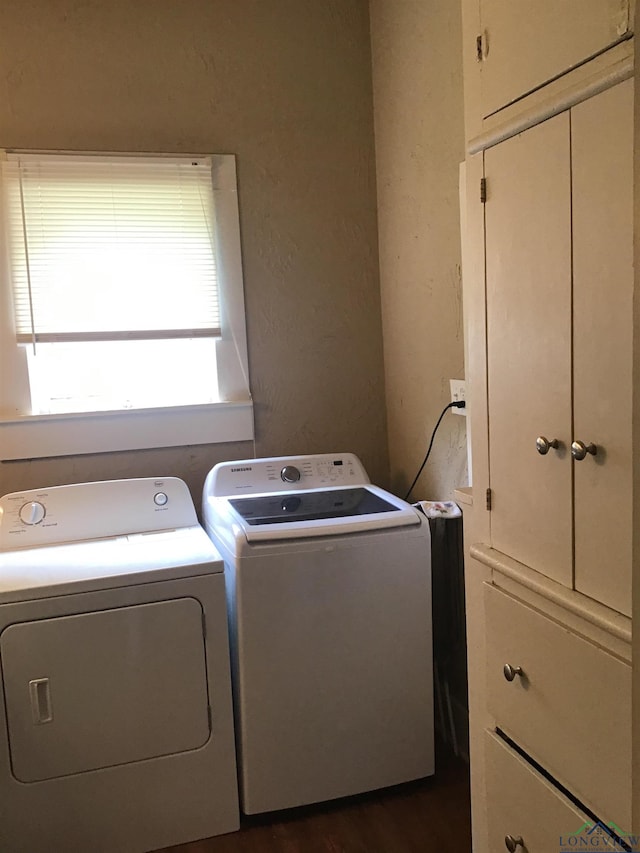 436 S Main St, Longview, TX 75601 - washroom with independent washer and dryer, cabinet space, and dark wood-style flooring