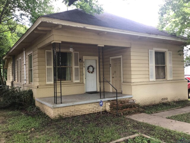 436 S Main St, Longview, TX 75601 - bungalow with a porch and brick siding