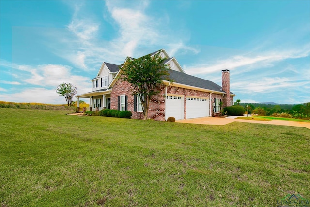 view of front of property featuring a garage and a front yard