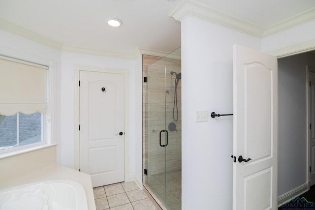 bathroom featuring crown molding, tile patterned flooring, and an enclosed shower