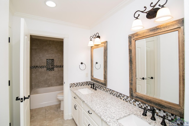 bathroom featuring vanity, tile patterned floors, crown molding, toilet, and tasteful backsplash