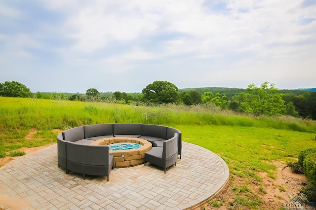 view of patio / terrace featuring a fire pit