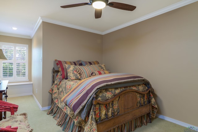 bedroom featuring light colored carpet, ceiling fan, and crown molding