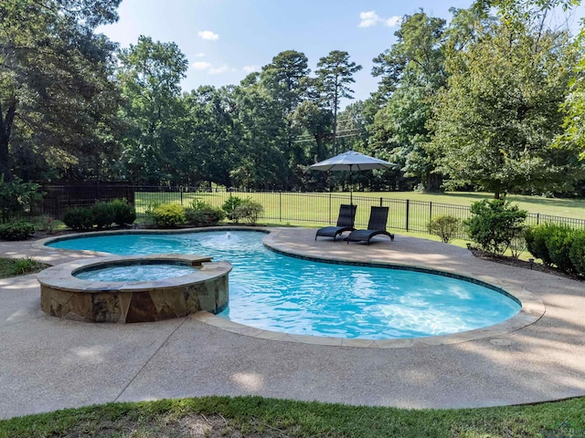 view of pool with an in ground hot tub and a patio area