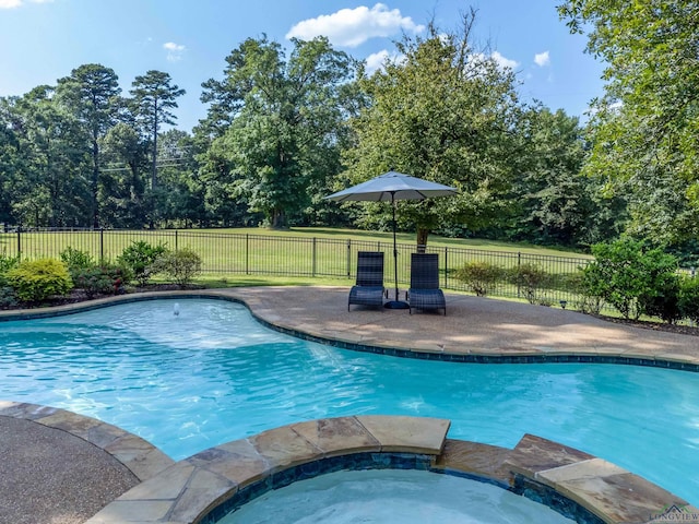 view of swimming pool featuring an in ground hot tub