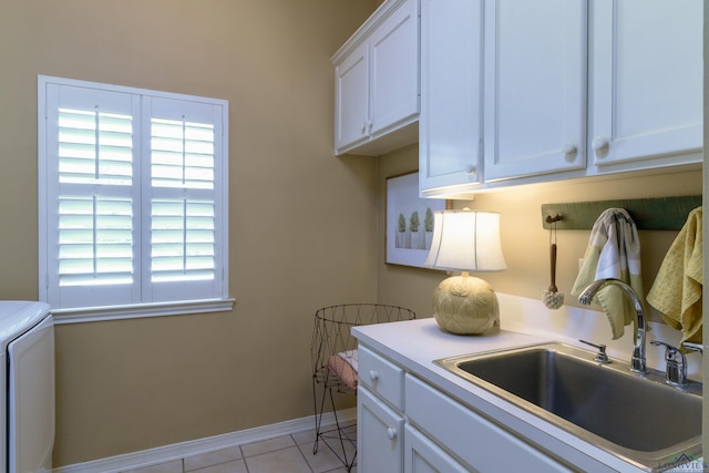 laundry area with washer / clothes dryer, sink, light tile patterned floors, and cabinets