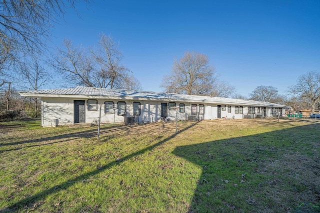 exterior space with a front lawn