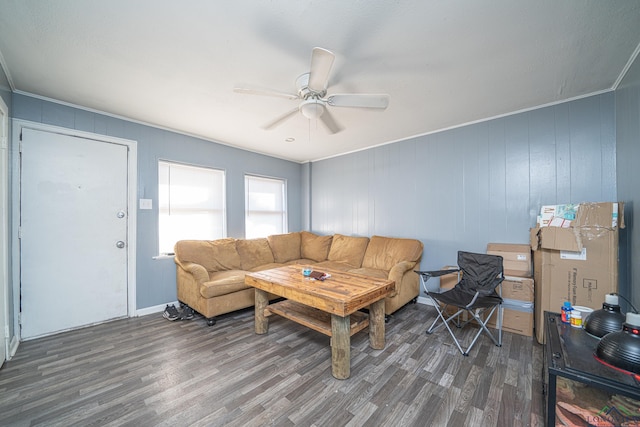 living room featuring ceiling fan and dark wood-type flooring