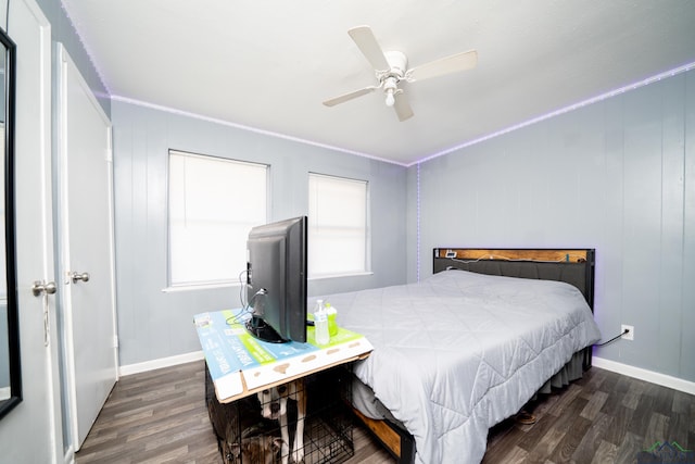 bedroom with ceiling fan, dark hardwood / wood-style flooring, and crown molding