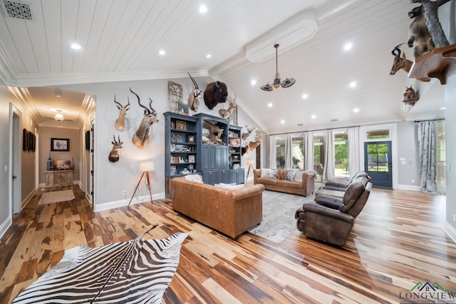 1882 County Road 3000, Joaquin, TX 75954 - living room featuring light wood finished floors, ornamental molding, wooden ceiling, lofted ceiling, and a chandelier