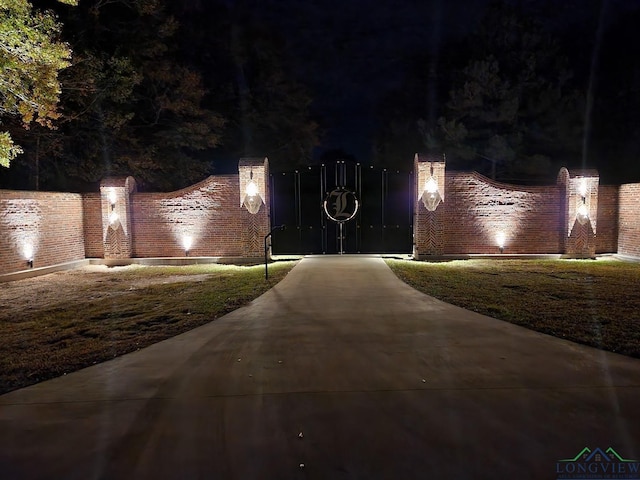 1882 County Road 3000, Joaquin, TX 75954 - view of gate at night