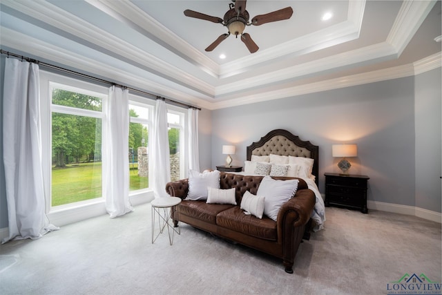 1882 County Road 3000, Joaquin, TX 75954 - carpeted bedroom featuring a tray ceiling, ornamental molding, and a ceiling fan